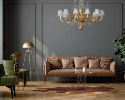 ویدیوی استوک از طراحی داخلی زیبا برای اتاق نشیمن با صندلی‌های راحتی مخمل سبز، مبل چرمی قهوه‌ای، آباژور زمینی، میز قهوه‌خوری و دیوار خالی